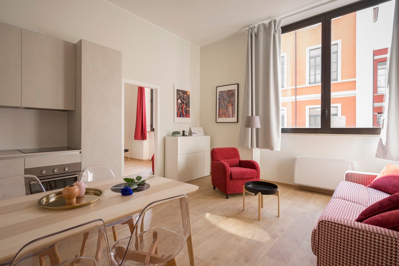 A warm, homely living and dining space with soft furnishings and natural light